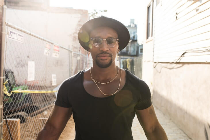 Man in Black Crew Neck Wearing Black Hat