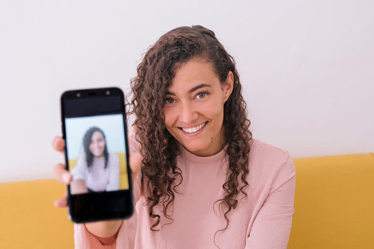 Young Female Beautiful Smile Photographing Herself