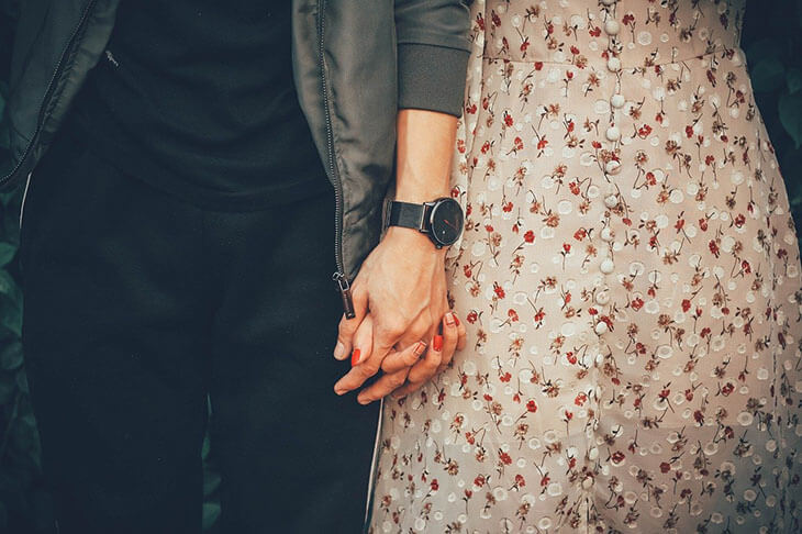 Couple Holding Hands Together