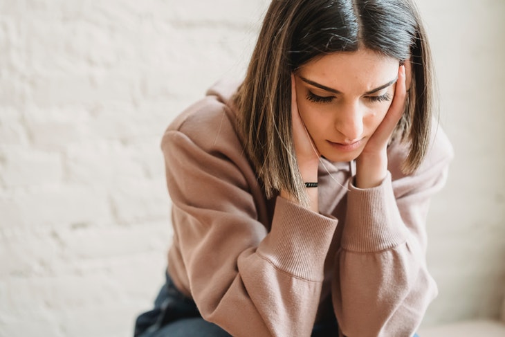 Depressed Woman Sitting in Room