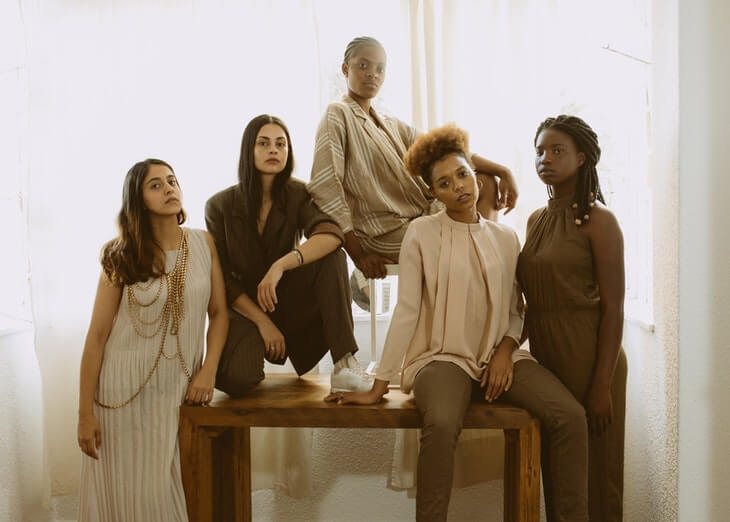 Women Sitting on Brown Wooden Bench