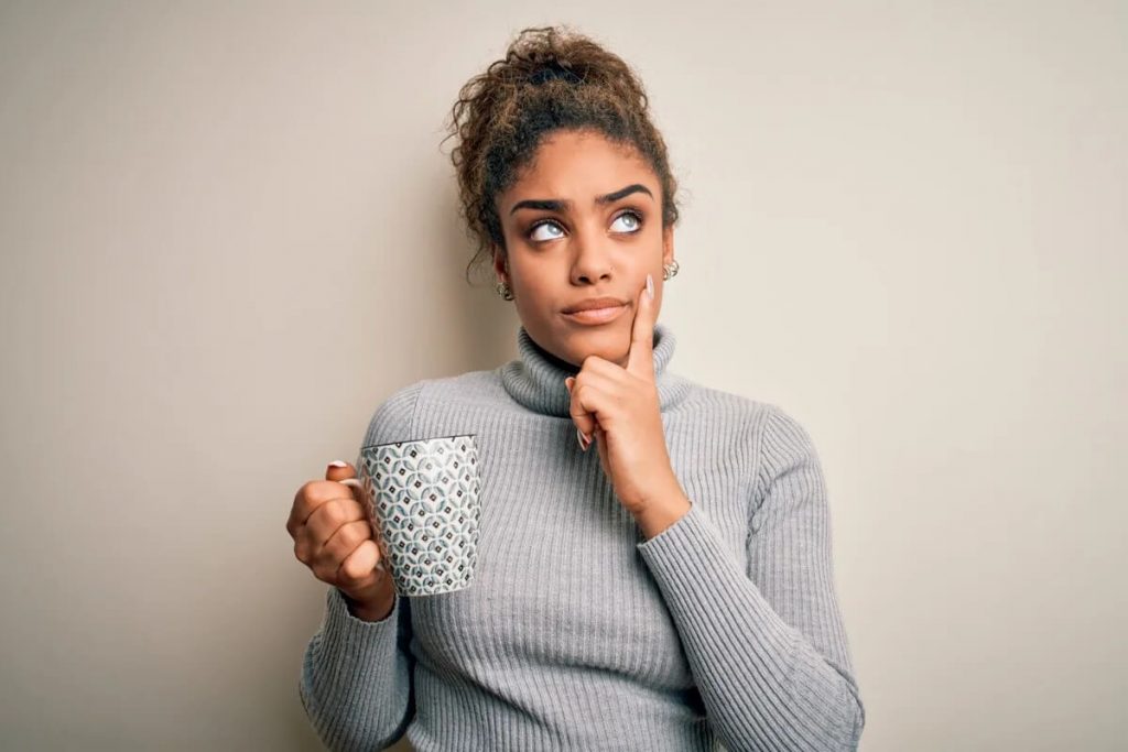 Woman Wondering Thinking with Cup