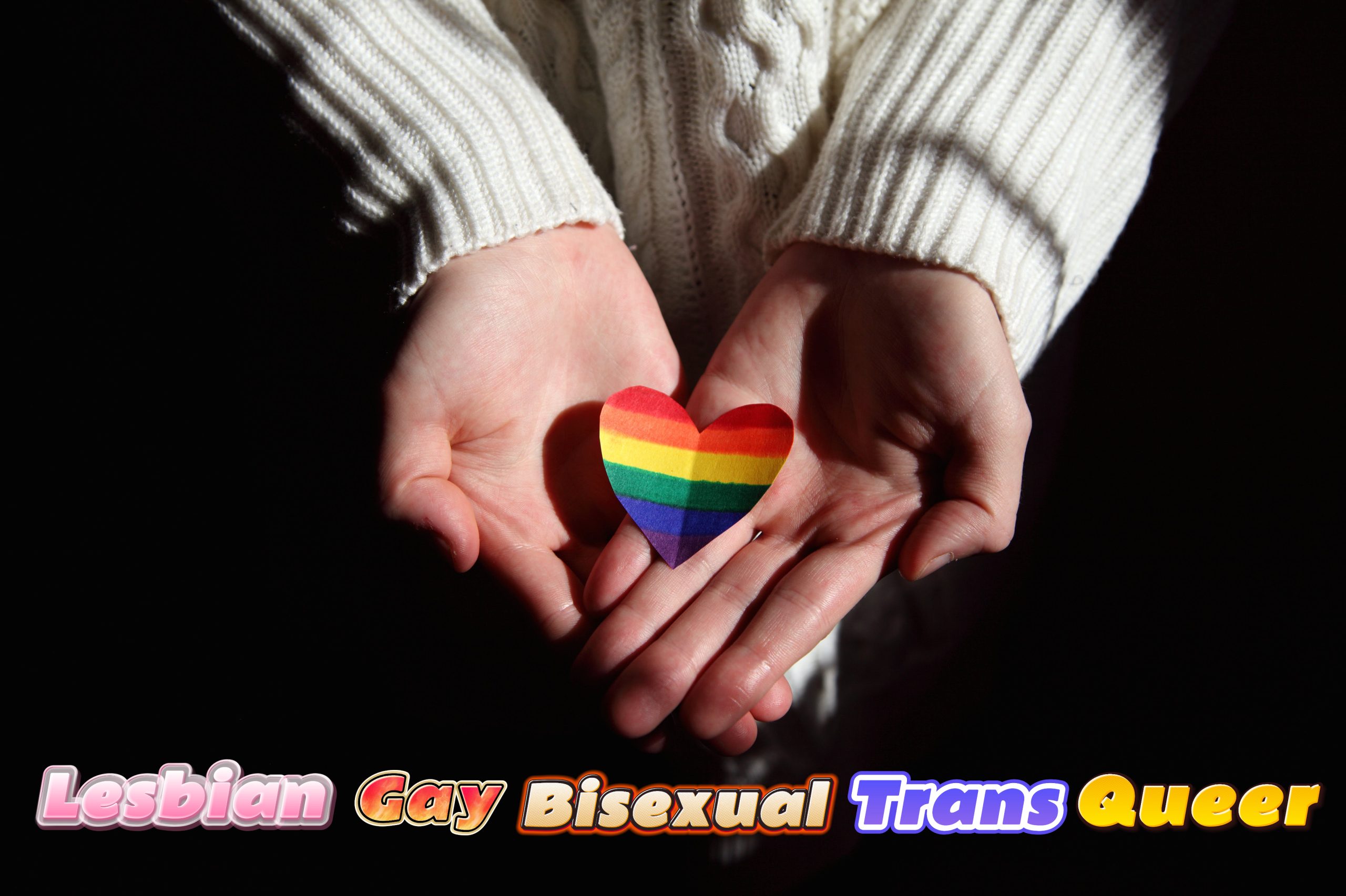 LGBTQ，A pair of hands holding a rainbow-colored heart