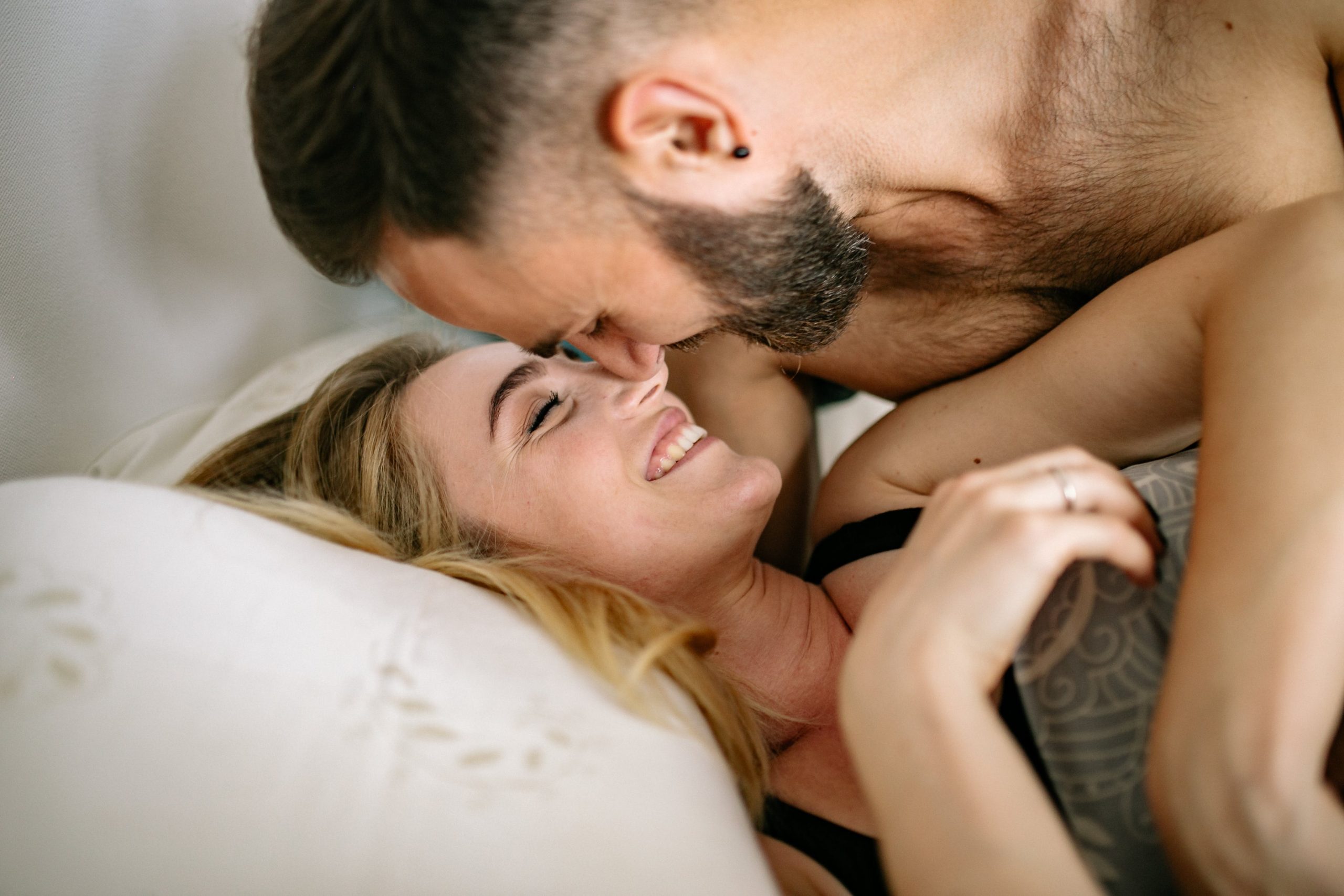 A man and woman having casual sex on the bed 